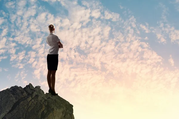 Businesswoman on top of hill — Stock Photo, Image