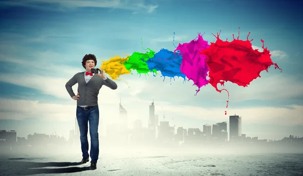 Young man with photo camera — Stock Photo, Image