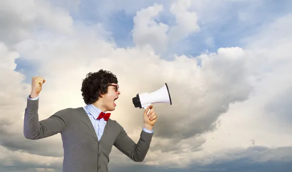 Jovem com megafone — Fotografia de Stock