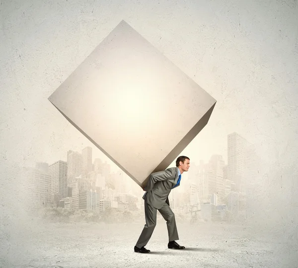 Businessman carrying cube — Stock Photo, Image