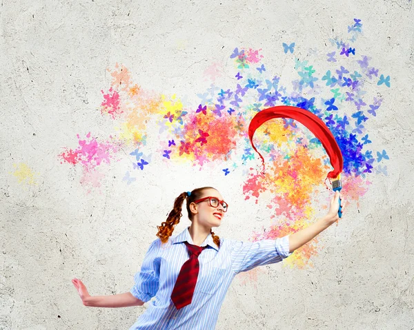 Young woman with paint brush — Stock Photo, Image