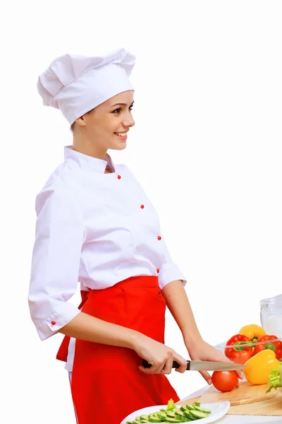 Jovem cozinheiro preparando alimentos — Fotografia de Stock