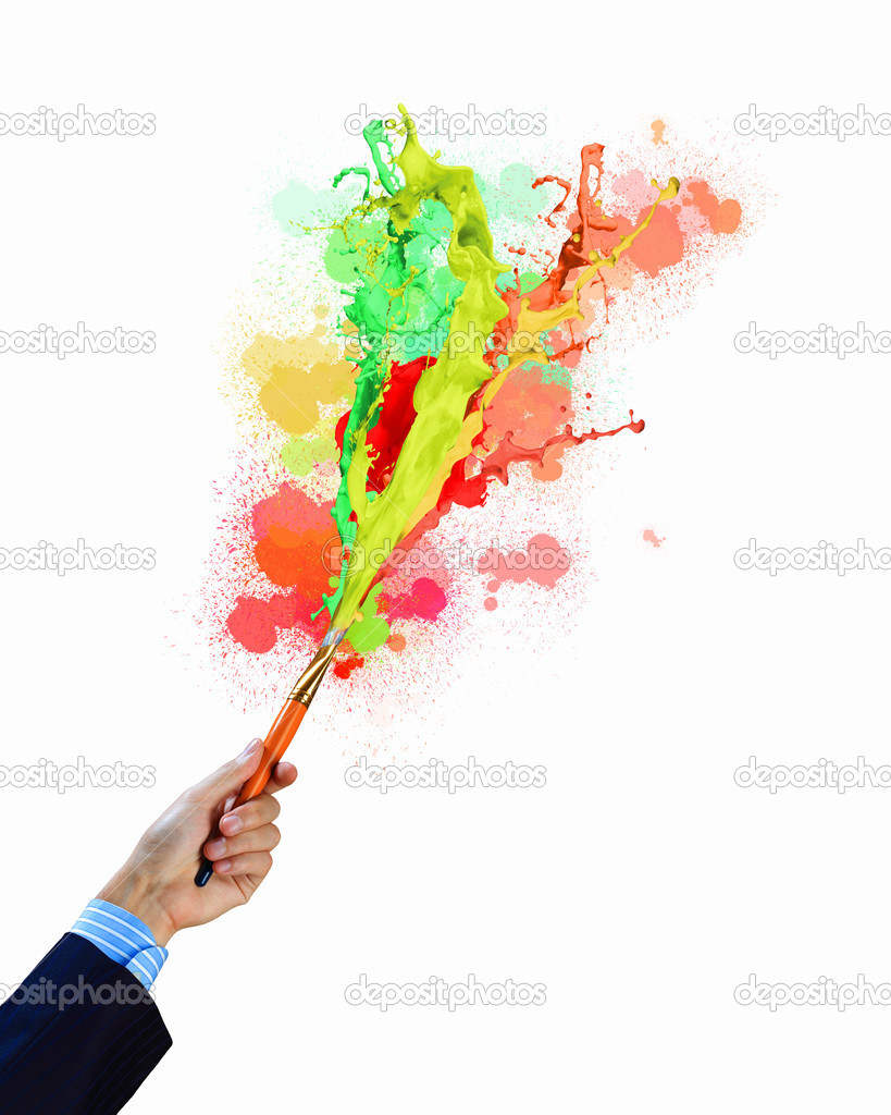 Human hand holding paint brush