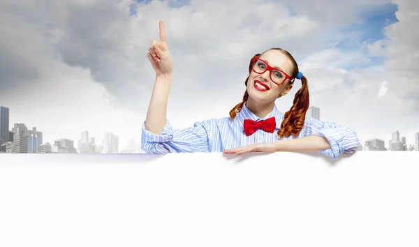 Woman with a blank billboard — Stock Photo, Image