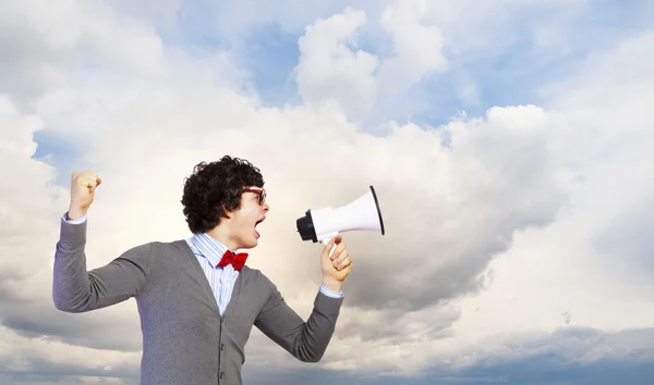 Jovem com megafone — Fotografia de Stock