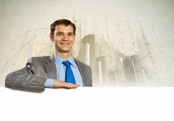 Businessman with blank banner — Stock Photo, Image