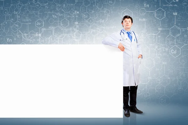 Male doctor with banner — Stock Photo, Image