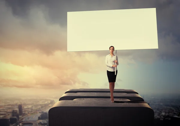 Business woman with banner — Stock Photo, Image