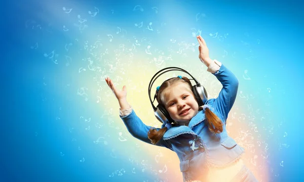 Little girl in headphones — Stock Photo, Image