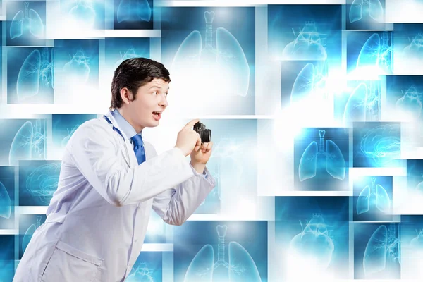 Doctor with photo camera — Stock Photo, Image