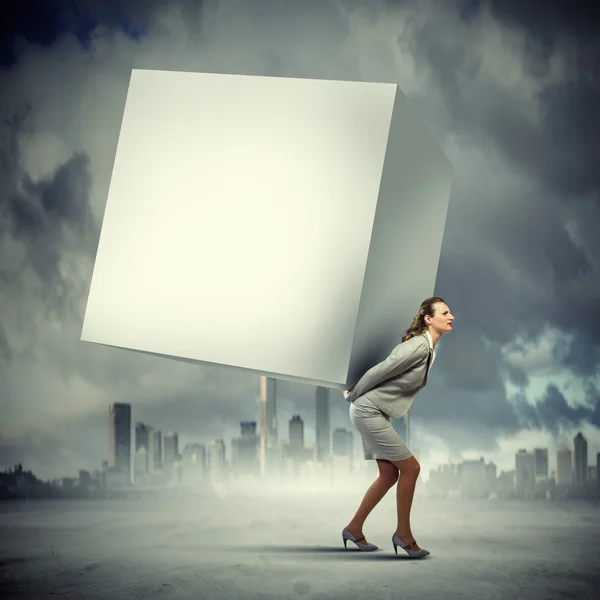 Businesswoman carrying cube — Stock Photo, Image