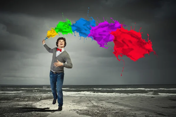 Young man and colour splash — Stock Photo, Image
