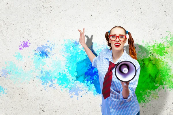 Funny looking woman with megaphone — Stock Photo, Image