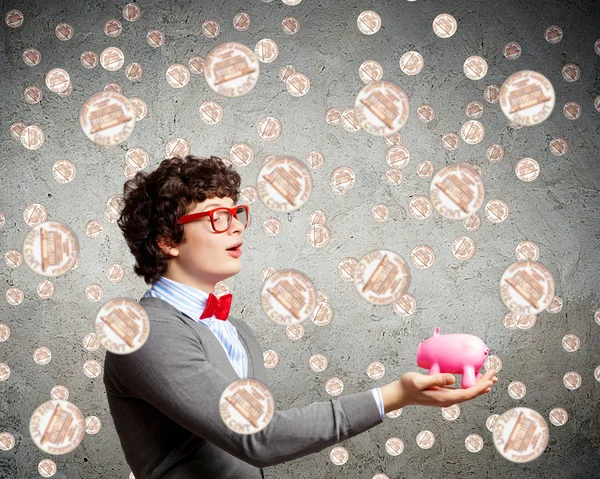 Young businessman holding moneybox — Stock Photo, Image