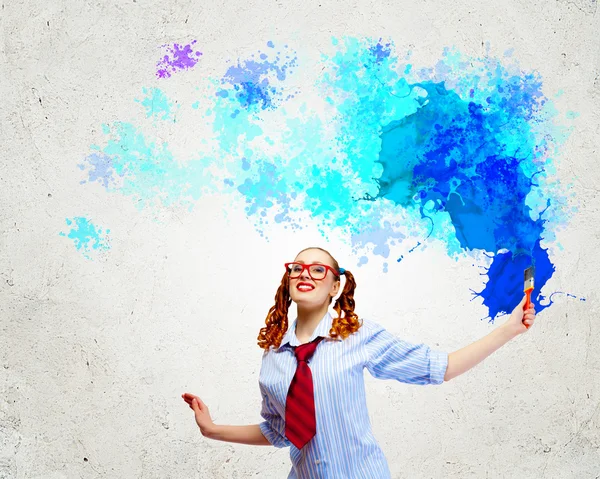 Young woman with paint brush — Stock Photo, Image