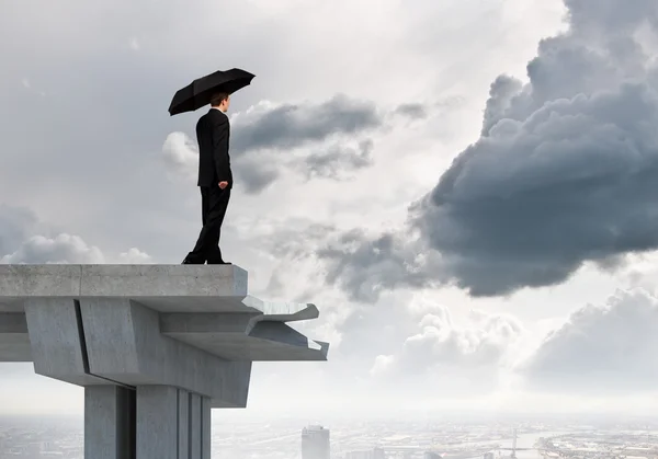 Businessman standing on bridge — Stock Photo, Image