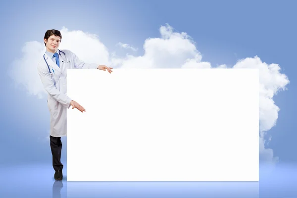 Male doctor with banner — Stock Photo, Image