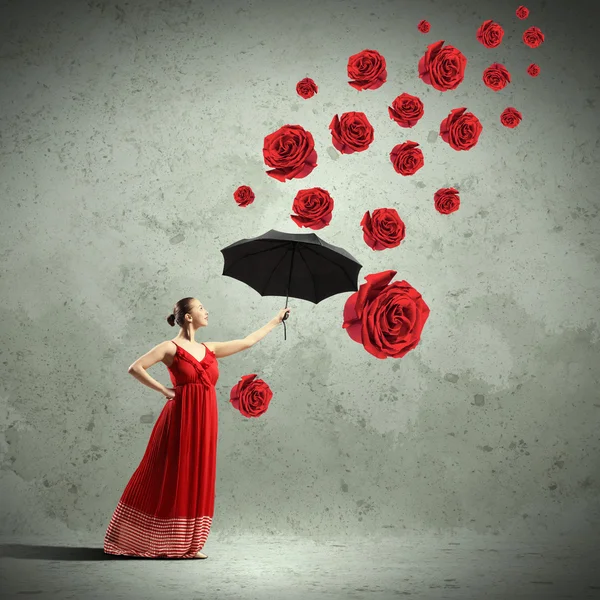 Ballet dancer in flying satin dress with umbrella — Stock Photo, Image