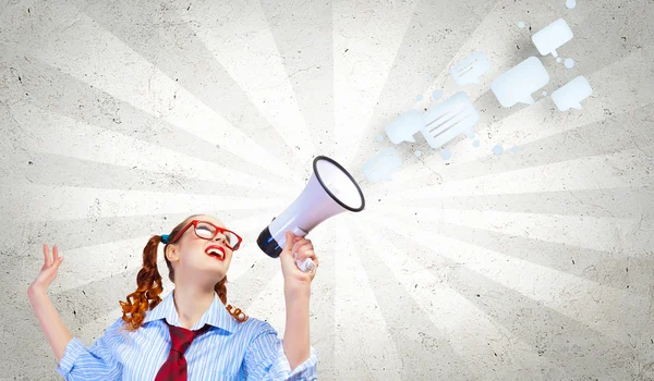 Funny looking woman with megaphone — Stock Photo, Image