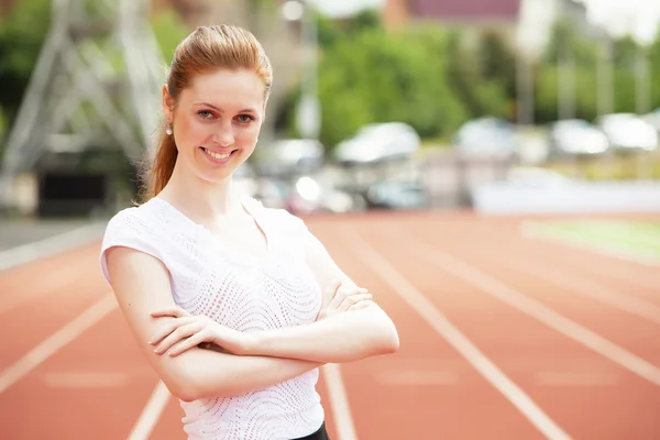 Business woman at athletic stadium — Stock Photo, Image