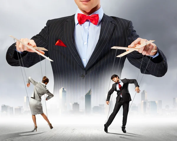 Businessman puppeteer — Stock Photo, Image