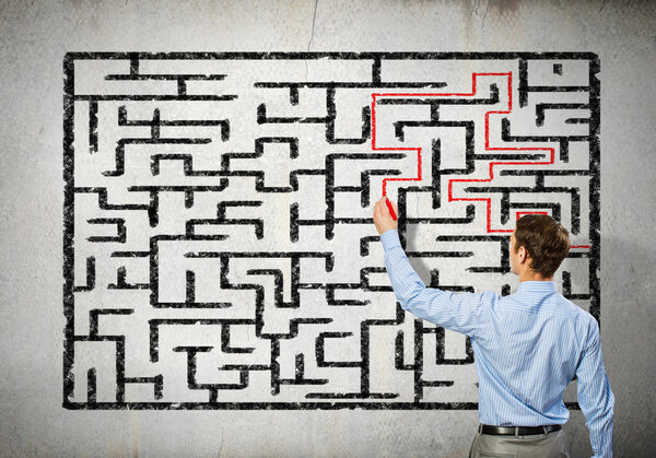Businessman solving labyrinth problem