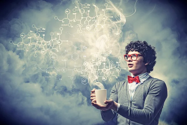 Young man with smoke coming out of cup — Stock Photo, Image