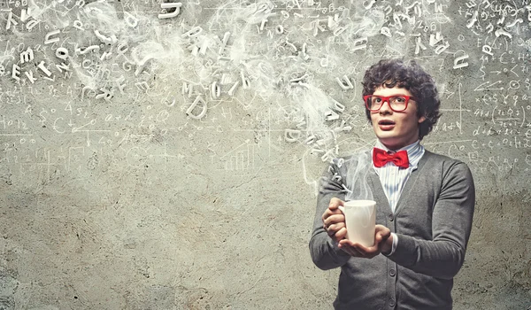 Young man with smoke coming out of cup — Stock Photo, Image