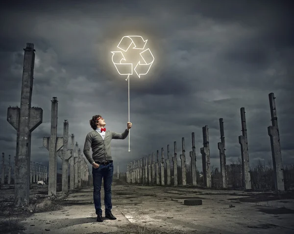 Young man with a recycle symbol — Stock Photo, Image
