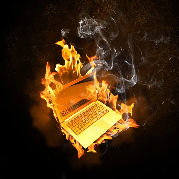 Laptop in fire flames — Stock Photo, Image