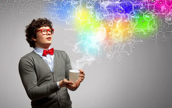 Young man with smoke coming out of cup — Stock Photo, Image