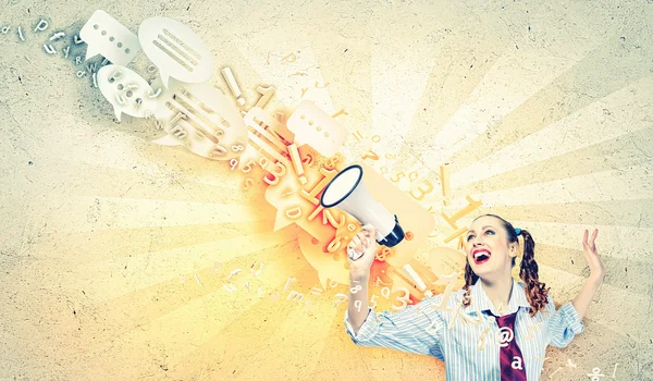 Funny looking woman with megaphone — Stock Photo, Image