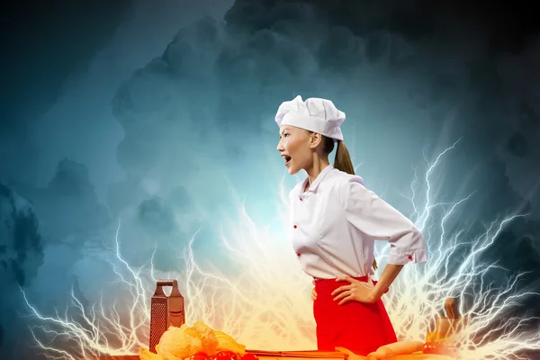 Asian female cook in anger — Stock Photo, Image