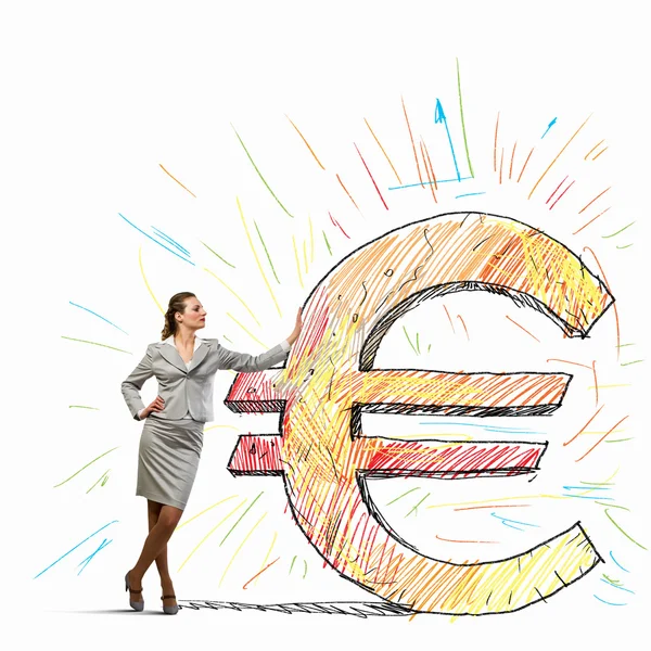 Businesswoman leaning on euro sign — Stock Photo, Image