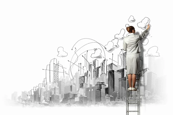 Businesswoman drawing on wall — Stock Photo, Image