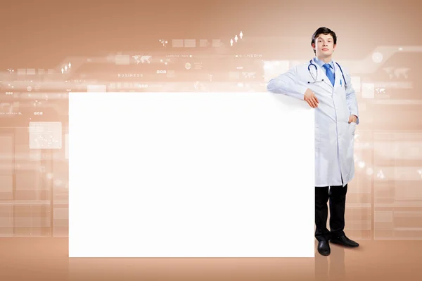 Male doctor with banner — Stock Photo, Image