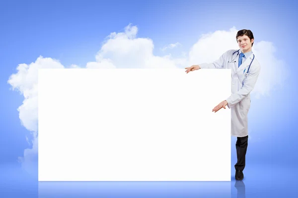 Doctor with blank banner — Stock Photo, Image