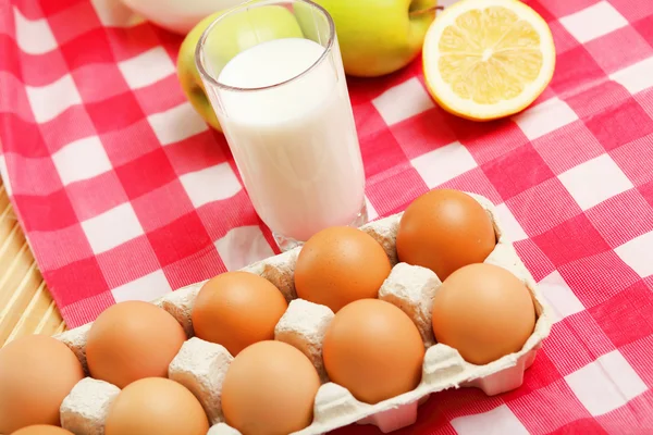 Milk in a glass jar and eggs Stock Photo