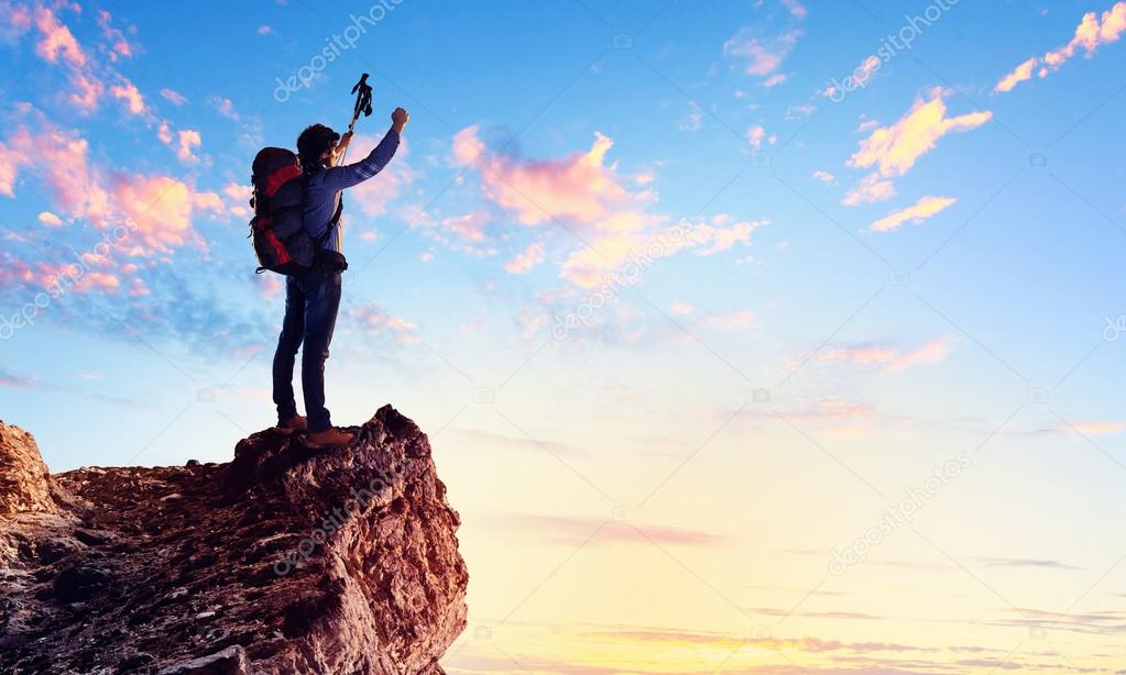 Young tourist atop of mountain