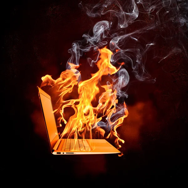 Laptop in fire flames — Stock Photo, Image