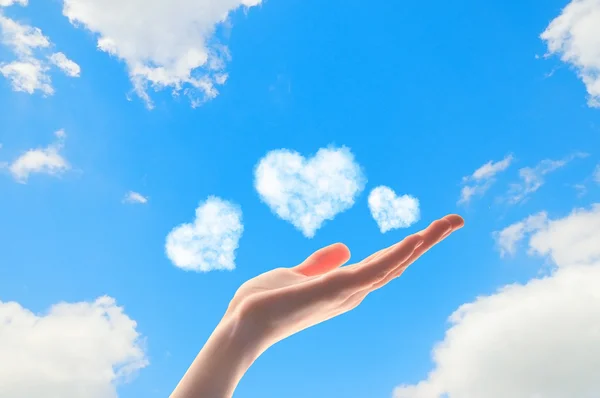 Close up of human hand with hearts — Stock Photo, Image