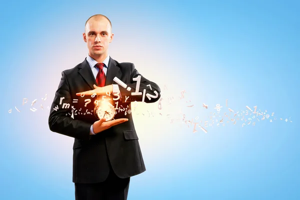 Business man holding alarmclock — Stock Photo, Image