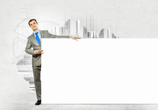 Businessman with blank banner — Stock Photo, Image