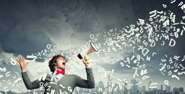 Young man with megaphone — Stock Photo, Image