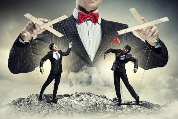 Businessman puppeteer — Stock Photo, Image