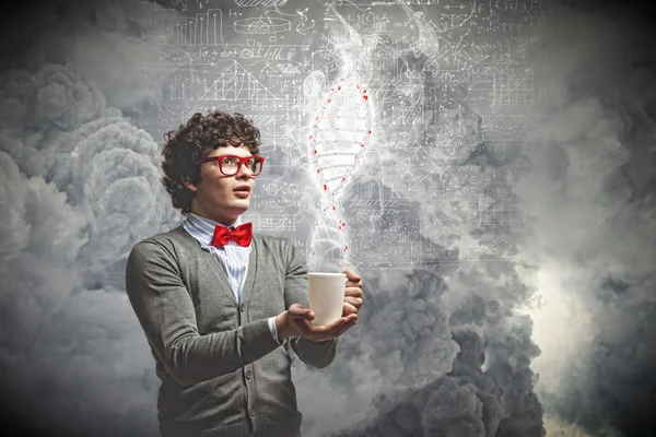 Young man with smoke coming out of cup — Stock Photo, Image