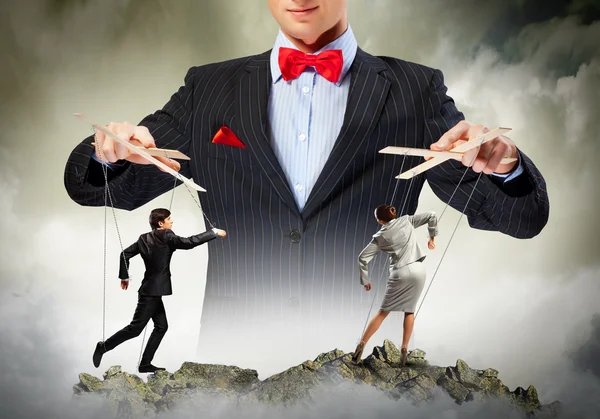 Businessman puppeteer — Stock Photo, Image