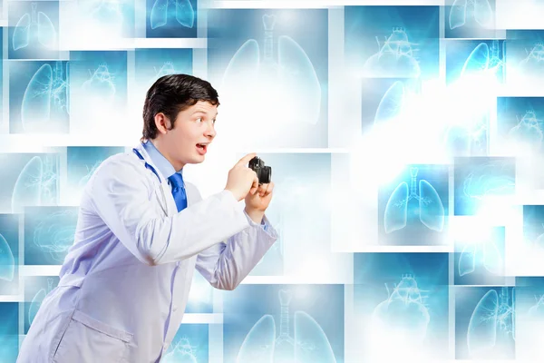 Doctor with photo camera — Stock Photo, Image