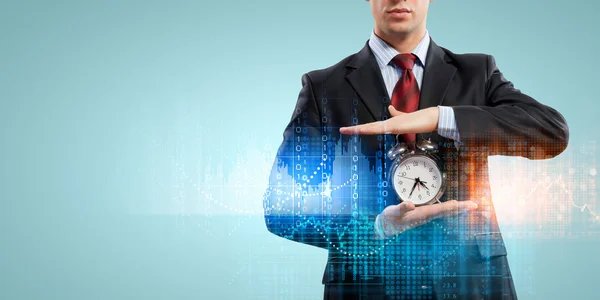 Business man holding alarmclock — Stock Photo, Image