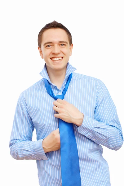 Businessman at home making his tie — Stock Photo, Image